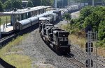 NS 1123 leads train 351 past train 80 in the station